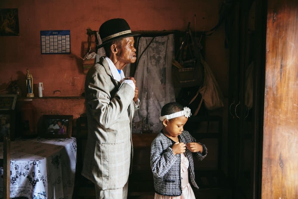 Dada Paul and his granddaughter Odliatemix get ready for church. He has lived with dementia for 11 years.