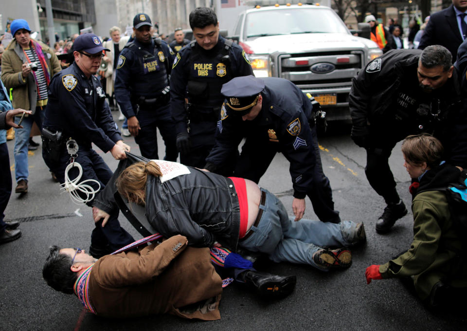 <p>Protestors clash with police as they attempt to block an ambulance believed to be carrying immigration rights activist Ravi Ragbir, the executive director of the New Sanctuary Coalition, during a demonstration against deportation outside the Jacob Javits Federal Building in Manhattan in New York City, Jan. 11, 2018. (Photo: Eduardo Munoz/Reuters) </p>