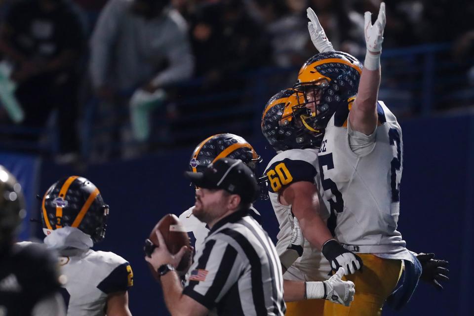 Prince Avenue's Josh Britt (25) celebrates after scoring a touchdown during a GHSA high school football state championship game between Swainsboro and Prince Avenue in Atlanta, on Thursday, Dec. 8, 2022. 