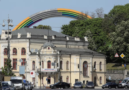 A Soviet monument, "Arch of the Friendship of Nations", painted with rainbow colours, in celebration of diversity ahead of the Eurovision Song Contest, is seen in central Kiev, Ukraine May 4, 2017. REUTERS/Gleb Garanich