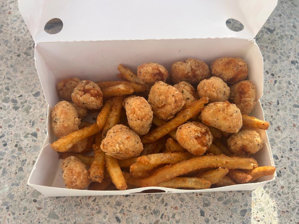 box of chicken bites and fries from checkers
