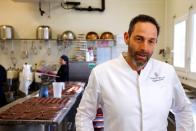 Christian Boillat, owner of the Boillat Confectionery and supplier of Farmy.ch an online shop for home delivery of regional and organic products, poses during the coronavirus