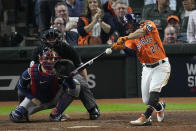 Houston Astros' Jose Altuve hits a home run during the seventh inning in Game 2 of baseball's World Series between the Houston Astros and the Atlanta Braves Wednesday, Oct. 27, 2021, in Houston. (AP Photo/Sue Ogrocki)
