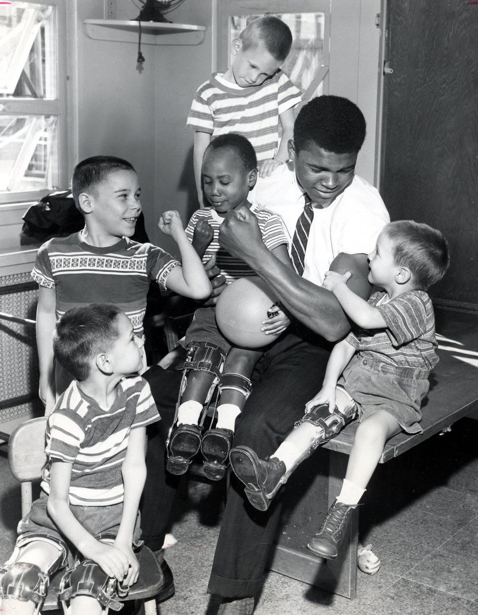 The Greatest: Home from the 1960 Olympics, where he was a gold medalist in boxing. Muhammad Ali paid visit to physically challenged children at Kosair hospital, then on Eastern Parkway.  Oct 20, 1960