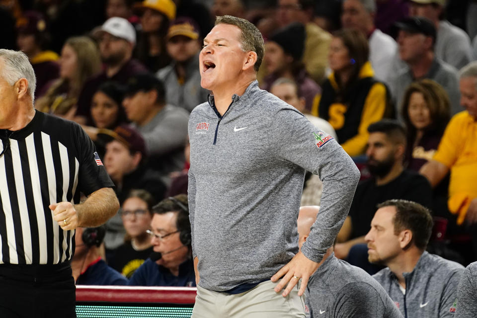 Arizona head coach Tommy Lloyd shouts out instructions to his team during the first half of an NCAA college basketball game against Arizona State, Saturday, Dec. 31, 2022, in Tempe, Ariz. (AP Photo/Darryl Webb)