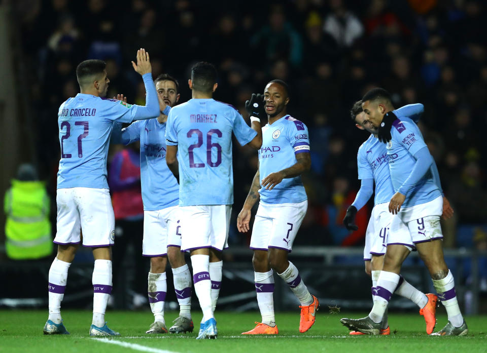 OXFORD, ENGLAND - DECEMBER 18: Raheem Sterling of Manchester City celebrates with teammates after scoring his team's third goal  during the Carabao Cup Quarter Final match between Oxford United and Manchester City at Kassam Stadium on December 18, 2019 in Oxford, England. (Photo by Richard Heathcote/Getty Images)