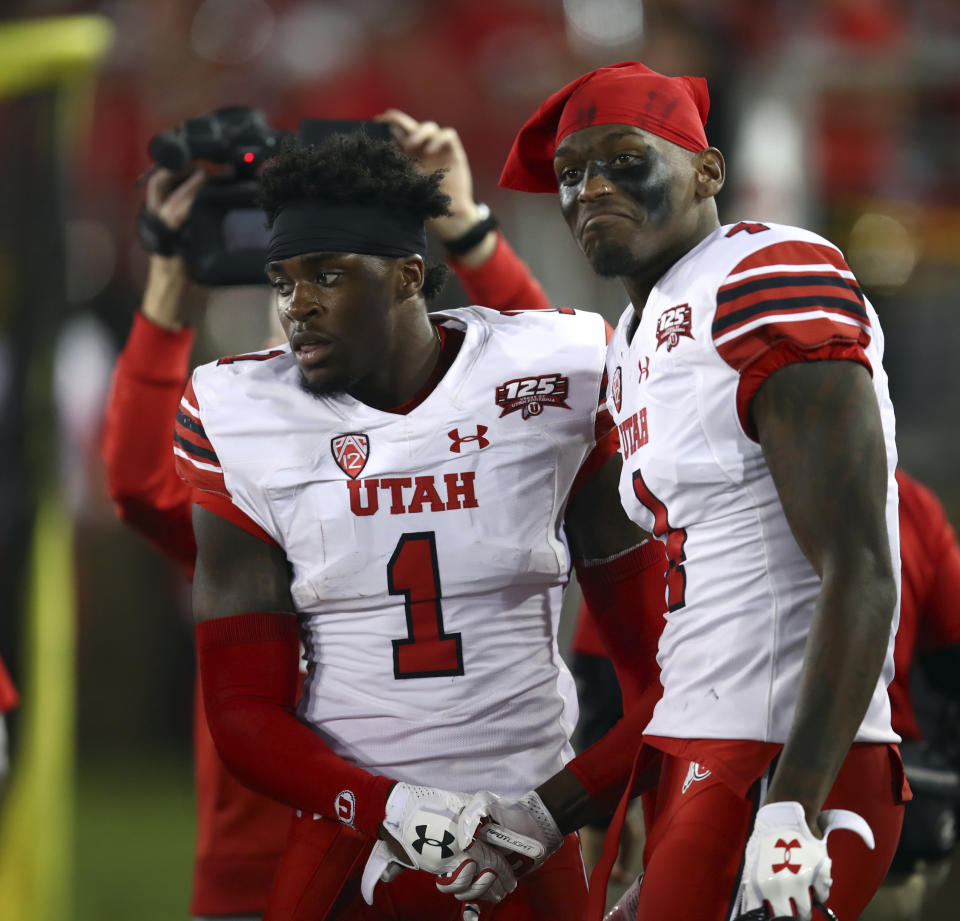 Utah's Tyrone Young-Smith, right, congratulates Jaylon Johnson (1) after Johnson scored a touchdown against Stanford during the first half of an NCAA college football game Saturday, Oct. 6, 2018, in Stanford, Calif. (AP Photo/Ben Margot)