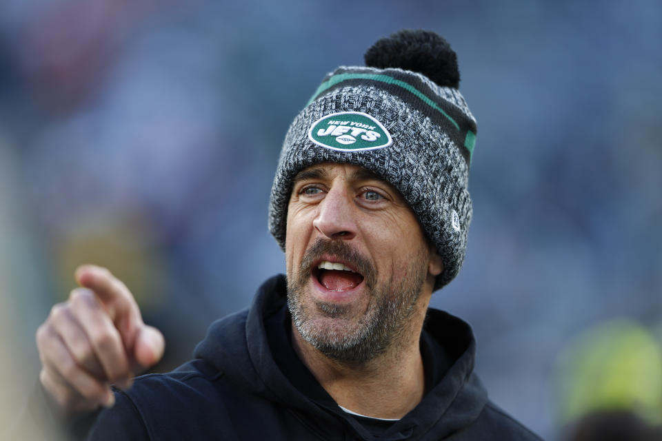 New York Jets quarterback Aaron Rodgers (8) walks on the field before an NFL football game between the New York Jets and the Miami Dolphins, Friday, Nov. 24, 2023, in East Rutherford, N.J. (AP Photo/Noah K. Murray)