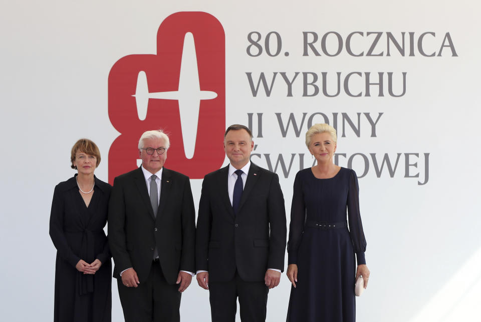 Polish President Andrzej Duda, second right, and his wife Agata Kornhauser-Duda, right, pose with German President Frank-Walter Steinmeier, second left, and his wife Elke B'denbender prior a memorial ceremony marking the 80th anniversary of the start of World War II in Warsaw, Poland, Sunday, Sept. 1, 2019.(AP Photo/Czarek Sokolowski)