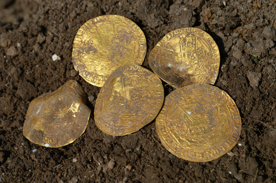 Some of the gold coins.Four amateur metal detectorists have uncovered a hoard of 14th century coins in a field in   Hambleden, Buckinghamshire- worth an estimated £150,000. See SWNS story SWSYcoins.A group of amateur metal detectorists dug up a 14th century hoard of more than 550 rare gold and silver coins worth an estimated £150,000.The four - including three Geordies - struck gold in a field in Buckinghamshire and were initially delighted to find 12 ornately decorated silver Edward I and II coins.But the men - more used to digging up shotgun shells and thimbles than treasure - were astonished to find coin after coin from the hidden ancient hoard.Over four days they excavated 557 coins - including 12 ultra-rare full gold nobles from the time of the Black Death.
