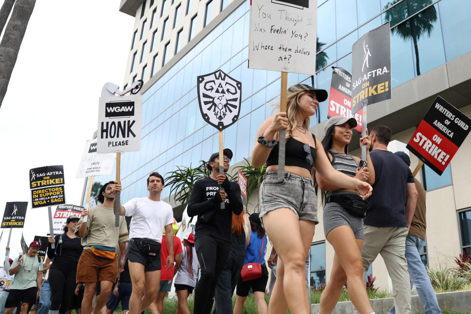 SAG-AFTRA actors and Writers Guild of America (WGA) writers walk the picket line during their ongoing strike outside Sunset Bronson studios and Netflix offices in Los Angeles, California, U.S., August 11, 2023.