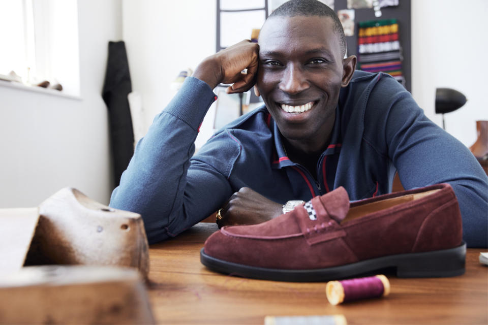 Armando Cabral shows off a suede loafer from his eponymous shoe collection. - Credit: Courtesy