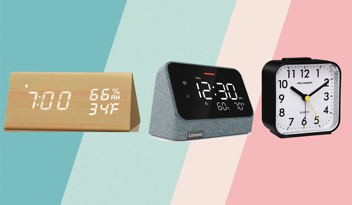 Three alarm clocks on a pastel background