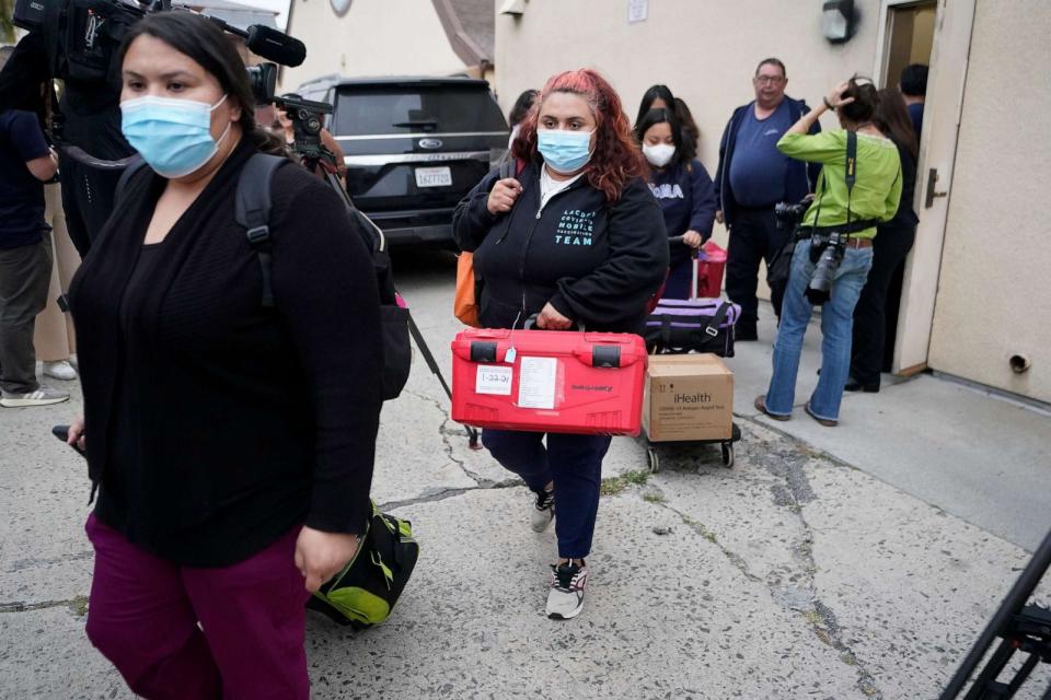 PHOTO: Los Angeles County Public Health Emergency Operations officials leave St. Anthony's Croatian Catholic Church after evaluating the newly arrived migrants being housed in Los Angeles on Wednesday, June 14, 2023. (Damian Dovarganes/AP, FILE)