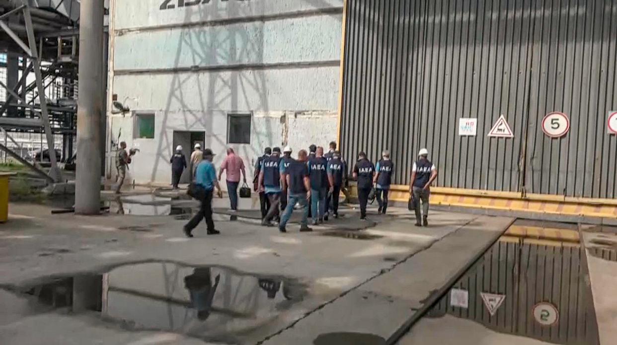 In this handout photo taken from video released by Russian Defense Ministry Press Service on Friday Sept. 2, 2022, members of International Atomic Energy Agency (IAEA) walk while inspecting the Zaporizhzhia Nuclear Power Plant in Enerhodar, southeastern Ukraine Thursday, Sept. 1, 2022. 