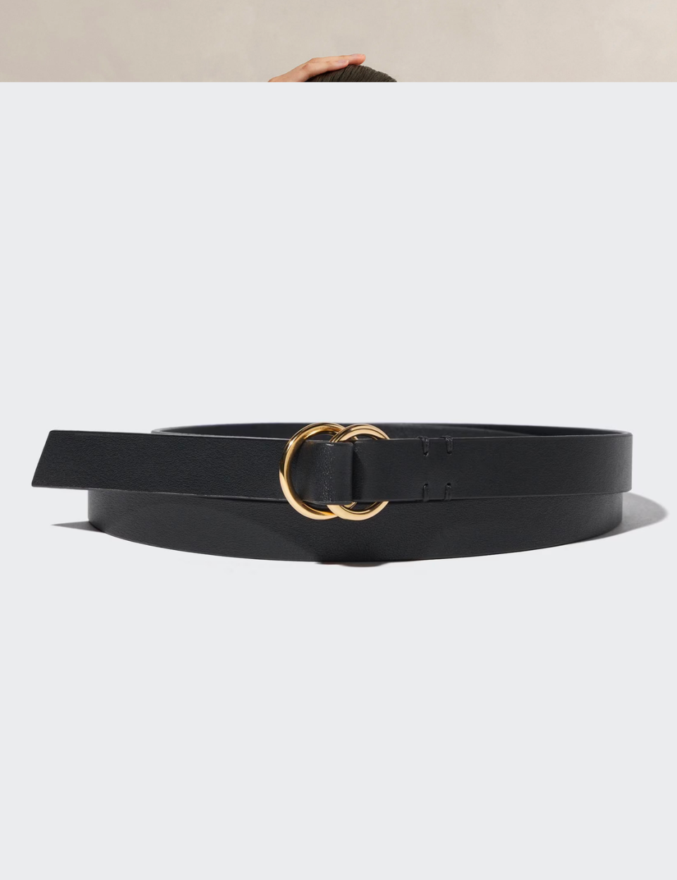 a black belt with a gold ring