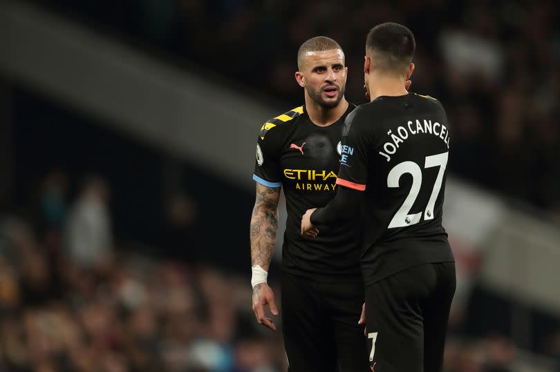 Kyle Walker of Manchester City in discussion with Joao Cancelo