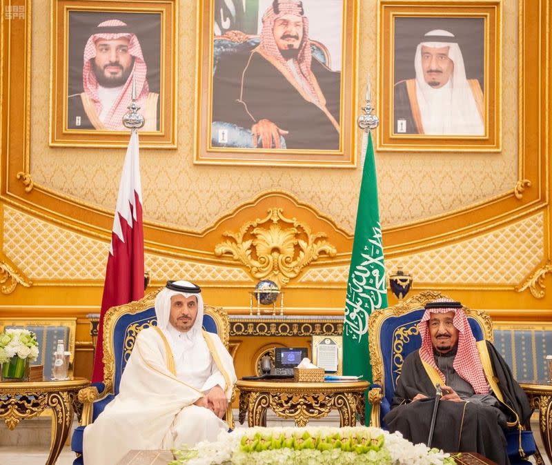 Saudi Arabia's King Salman bin Abdulaziz Al Saud meets Qatar's Prime Minister and Interior Minister Sheikh Abdullah bin Nasser bin Khalifa Al Thani during the Gulf Cooperation Council's (GCC) 40th Summit in Riyadh