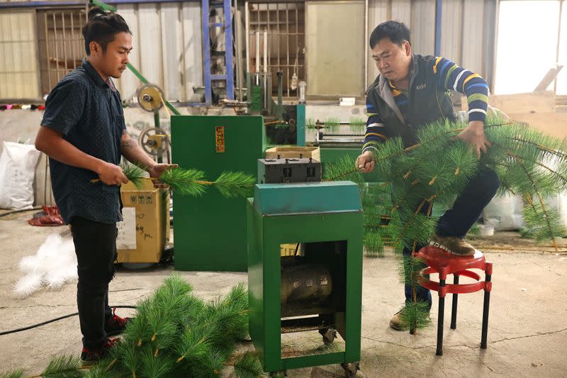 FILE PHOTO: Staff produce parts of a Christmas tree at the factory of Lien Teng Enterprise in Taichung