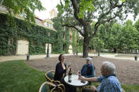 From left, Shana Ayers, of Kansas City, Mo., Susan Goodwin and Richard Goodwin, of Fresno, Calif., taste the 2016 Rubicon at the Inglenook winery Friday, June 12, 2020, in Rutherford, Calif. California wineries started uncorking their bottles and welcoming people back to their tasting rooms Friday as the state's $145 billion tourism industry gears up with hotels, zoos, museums and aquariums also allowed to reopen. The historic winery, which dates to 1879, reopened Friday to wine club members after being closed since mid March because of the coronavirus threat and will be open to the public on June 25. (AP Photo/Eric Risberg)