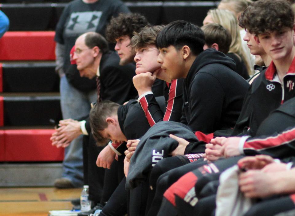 The White Pigeon wrestling team watches Climax-Scotts/Martin following the regional finals on Wednesday.
