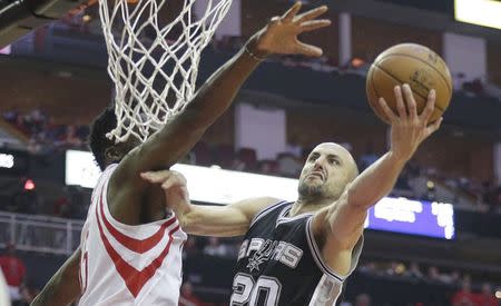 May 5, 2017; Houston, TX, USA; San Antonio Spurs guard Manu Ginobili (20) shoots against Houston Rockets center Clint Capela (15) in the second half in game three of the second round of the 2017 NBA Playoffs at Toyota Center. San Antonio won 103-92. Mandatory Credit: Thomas B. Shea-USA TODAY Sports