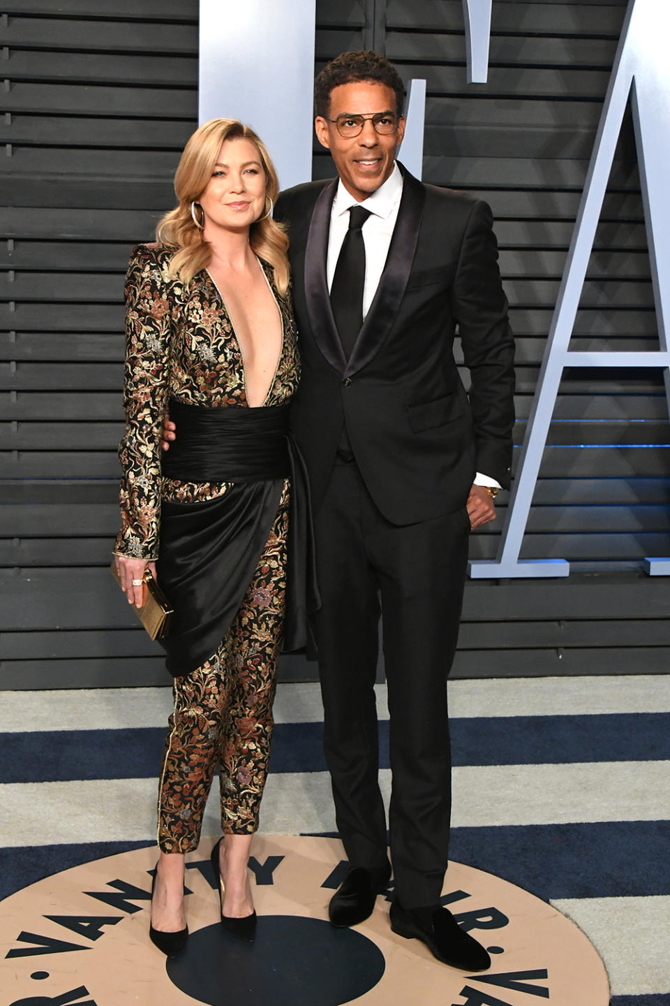 <p>Clad in an Azzaro jumpsuit, the <em>Grey’s Anatomy</em> star brought her own McDreamy to the <em>Vanity Fair</em> bash: husband Chris Ivery. (Photo: Jon Kopaloff/WireImage) </p>