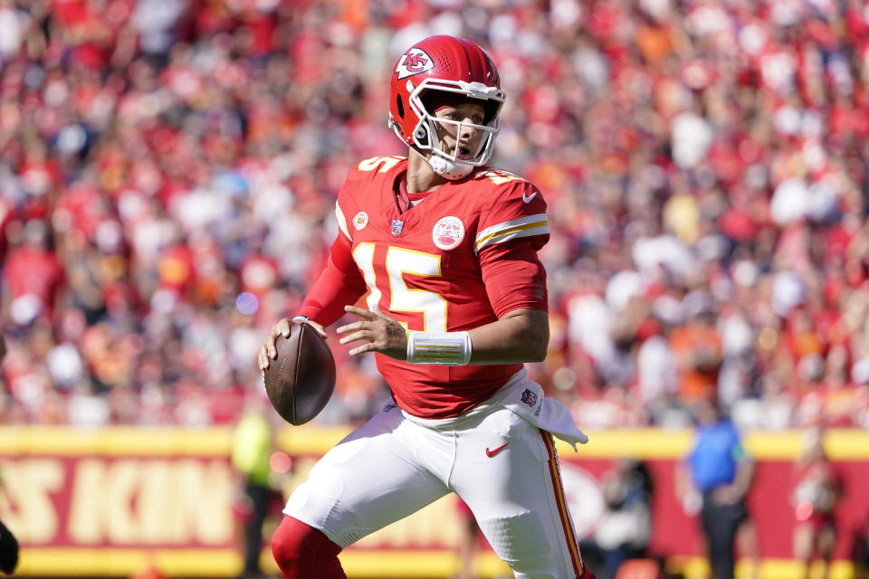 Kansas City Chiefs quarterback Patrick Mahomes runs with the ball during the first half of an NFL football game against the Chicago Bears Sunday, Sept. 24, 2023, in Kansas City, Mo. (AP Photo/Ed Zurga)