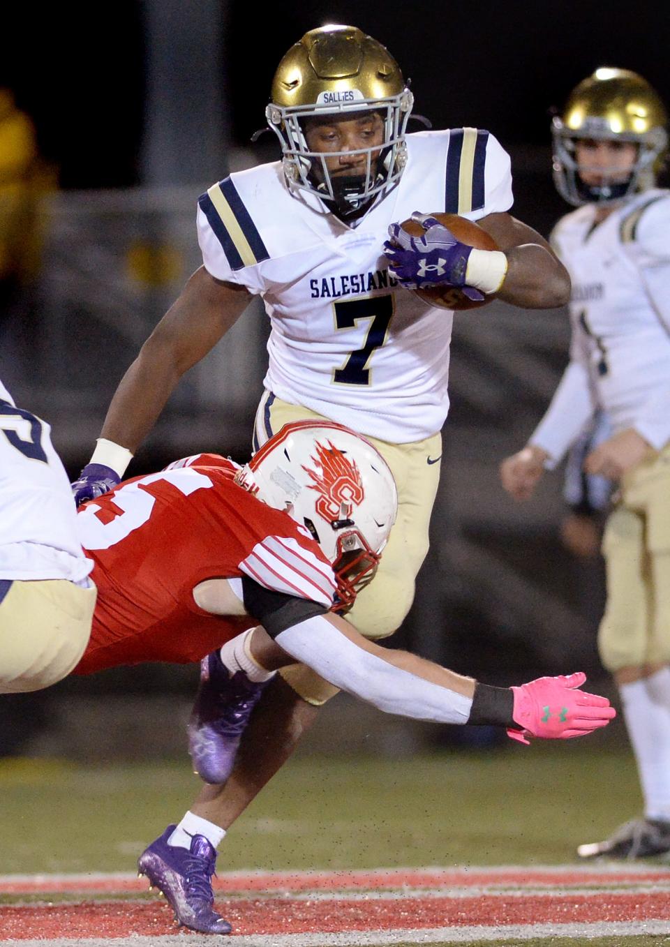 Andrew Ransome of Sallies is stopped by Smyrna's Cole Moyer.
