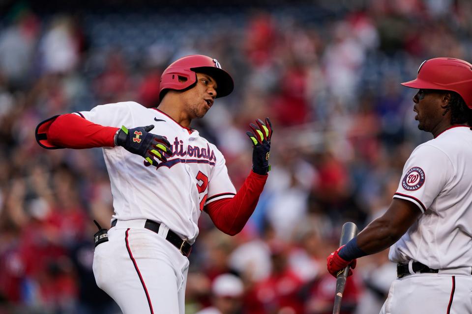 Washington Nationals' Juan Soto celebrates his two-run home with Josh Bell during the first inning of a baseball game against the New York Mets at Nationals Park, Wednesday, May 11, 2022, in Washington.