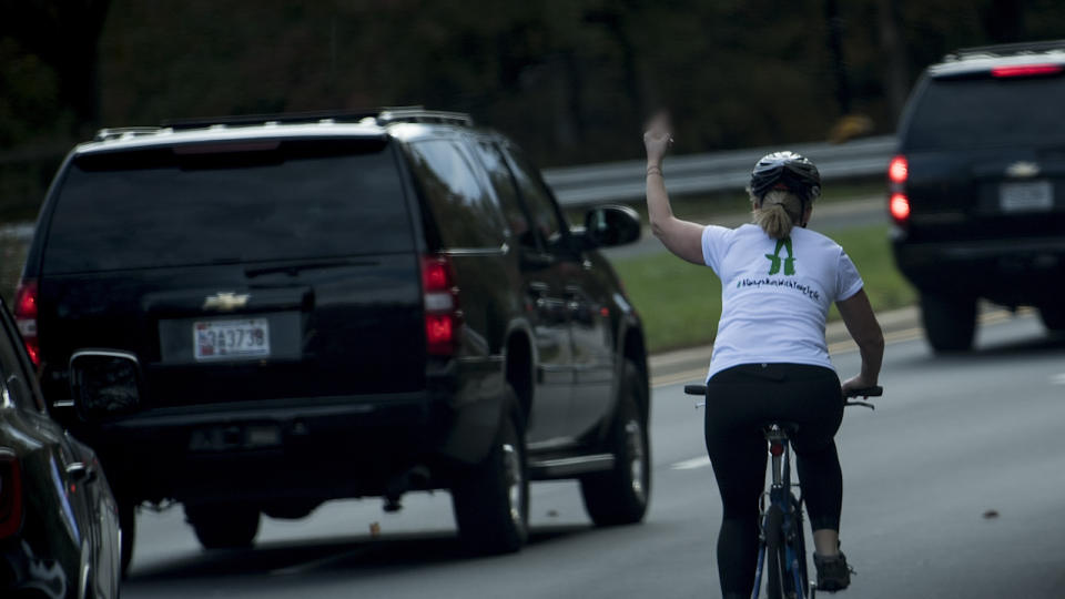 Virginia cyclist Juli Briskman gives the Trump motorcade the finger as it passes. (Photo: Getty Images)