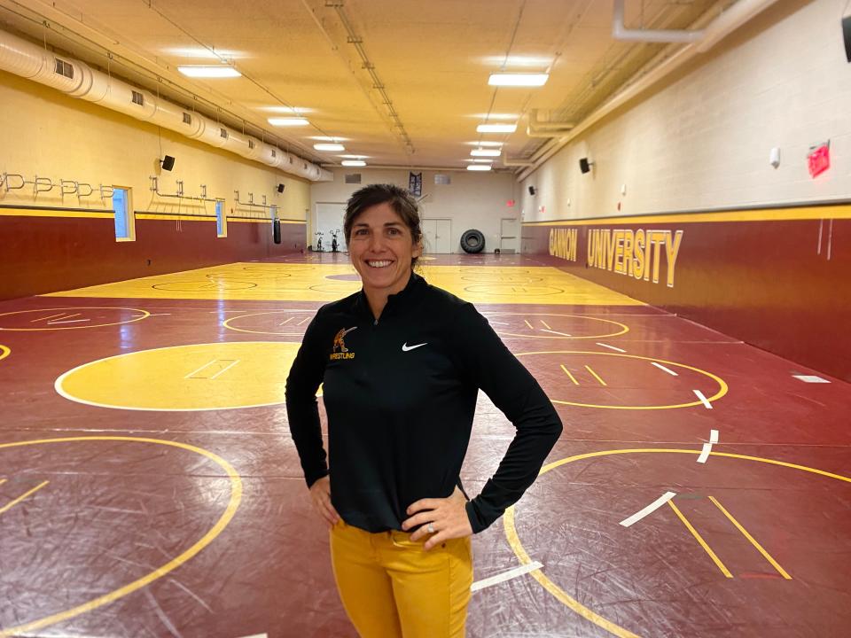 Erin Vandiver, the newly hired head coach of the Gannon University women’s wrestling team, stands in the Don and Diane Henry Wrestling Room at the Gannon Recreation and Wellness Center.