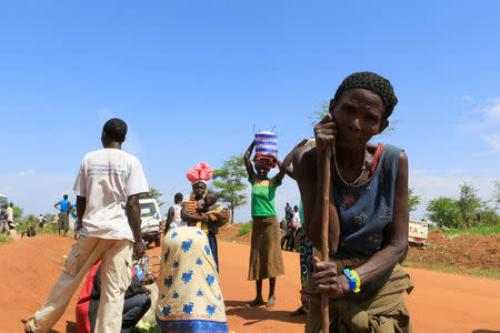 An elderly South Sudanese woman arrives in Lamwo after fleeing fighting in Pajok town across the border in northern Uganda April 5, 2017. REUTERS/James Akena