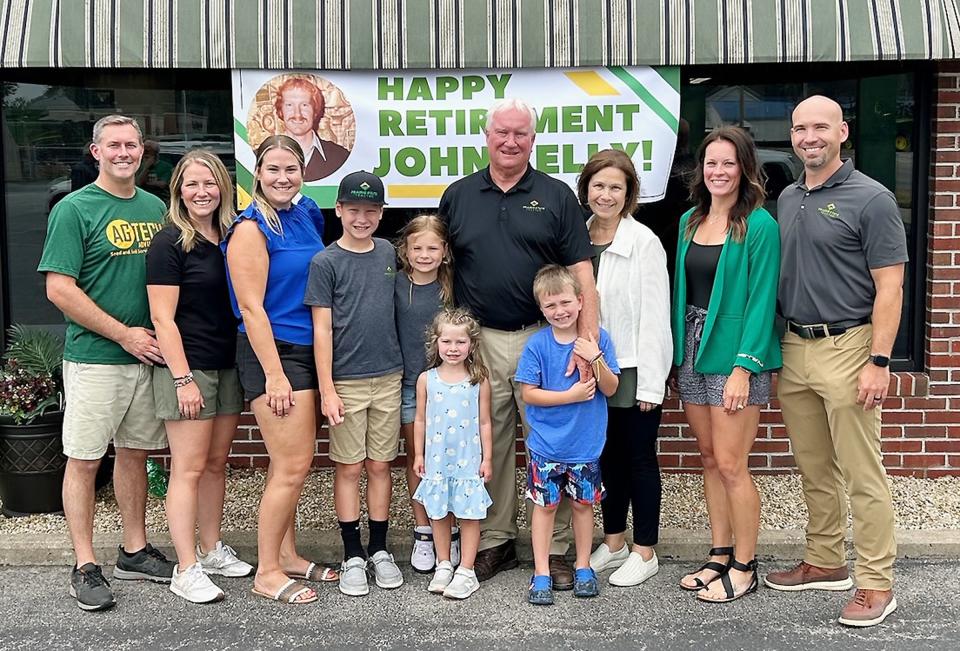 John Kelly seen here with family members, retired from the implement business after 45 years of serving the Pontiac and Livingston County area as co-owner of Prairie State Tractor. With Kelly are family members, from left, son-in-law Chad Trachsel, daughter Jackie Trachsel, daughter Jillian Kelly, grandchildren Owen, Lydia, Jane, Connor, John Kelly, wife Susanne Kelly, daughter-in-law Alison and son Paul Kelly.