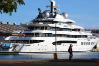 The superyacht Amadea is moored in Honolulu on Thursday, June 16, 2022. The Russian-owned superyacht seized by the United States arrived in Honolulu Harbor flying a U.S. flag after the U.S. last week won a legal battle in Fiji to take the $325 million vessel. (AP Photo/Audrey McAvoy)