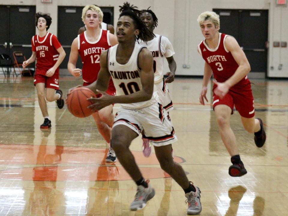 Taunton’s Chris Perault drives down court on a fast break during a Hockmock League game against North Attleboro.