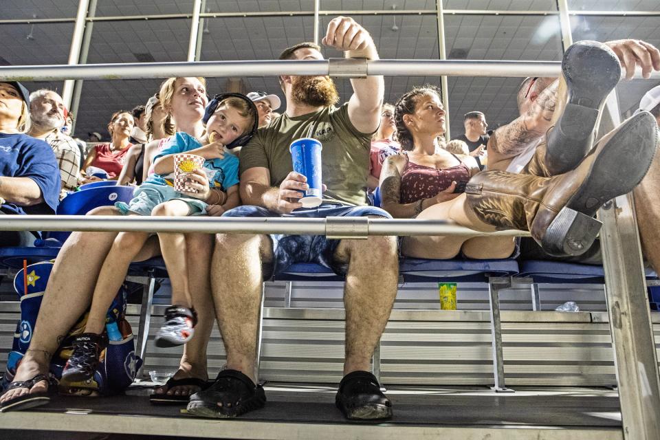 Visitors watch the Demolition Derby presented by Taylor & Messick at the Grandstand on day 9 of the 10-day Delaware State Fair in Harrington, Friday, July 28, 2023.