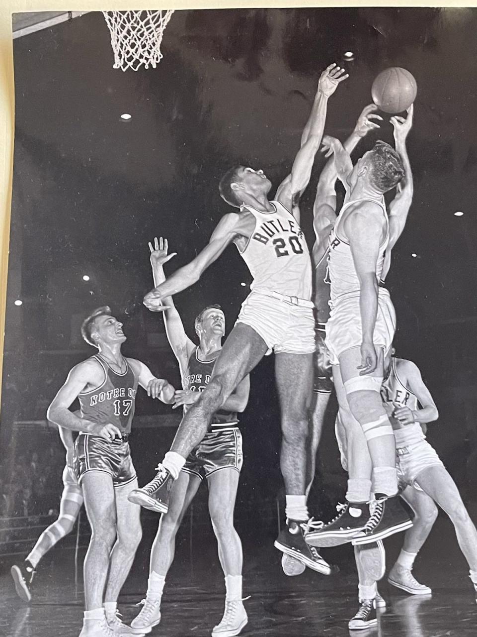 Hank Foster attempts to block a shot against Notre Dame in the mid-1950s. Foster was the first Black basketball player at Butler.