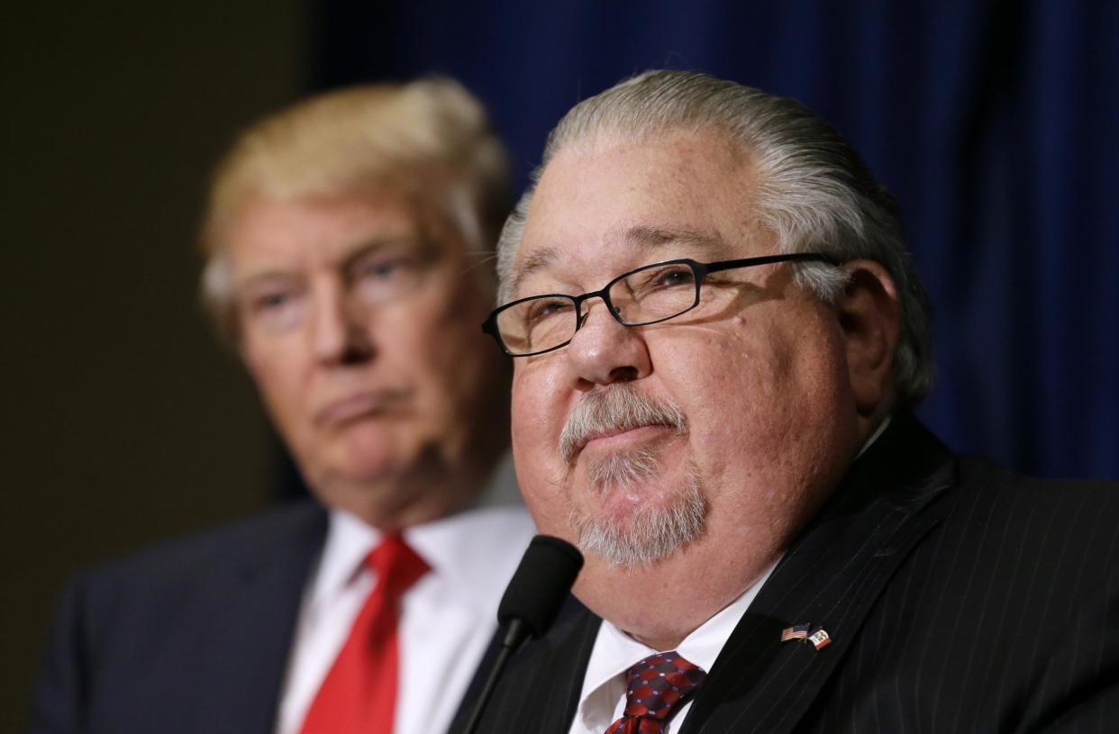 Sam Clovis speaks during a news conference as then-Republican presidential candidate Donald Trump watches: AP