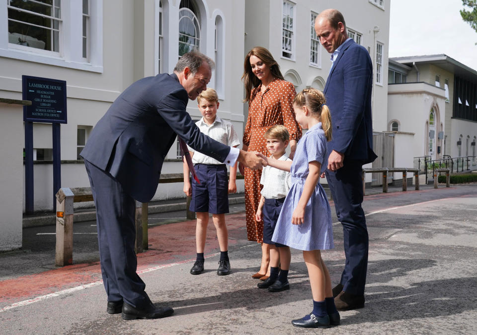 Prince George, Princess Charlotte and Prince Louis, accompanied by their parents the Duke and Duchess of Cambridge, are greeted by Headmaster Jonathan Perry as they arrive for a settling in afternoon at Lambrook School, near Ascot in Berkshire. The settling in afternoon is an annual event held to welcome new starters and their families to Lambrook and takes place the day before the start of the new school term. Picture date: Wednesday September 7, 2022.
