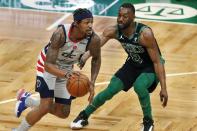 Boston Celtics' Kemba Walker (8) defends against Washington Wizards' Bradley Beal (3) during the first half of an NBA basketball game, Sunday, Feb. 28, 2021, in Boston. (AP Photo/Michael Dwyer)