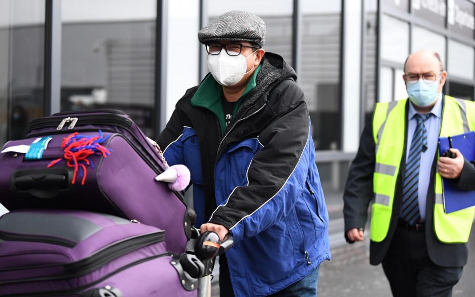 Chun Wong and his daughter Kiernan pictured leaving Edinburgh Airport  - Getty