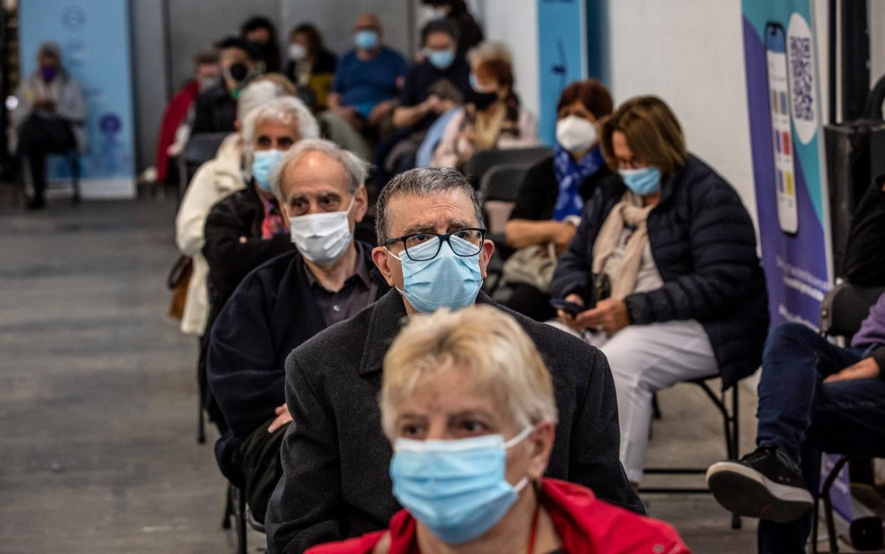 People in a waiting area after they have received a dose of a Covid-19 vaccine at a mass vaccination center inside the Fira de Barcelona exhibition space in Barcelona, Spain - Angel Garcia /Bloomberg