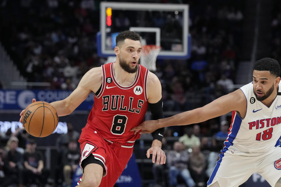 Chicago Bulls guard Zach LaVine (8) controls the ball next to Detroit Pistons guard Cory Joseph (18) during the second half of an NBA basketball game, Wednesday, March 1, 2023, in Detroit. (AP Photo/Carlos Osorio)