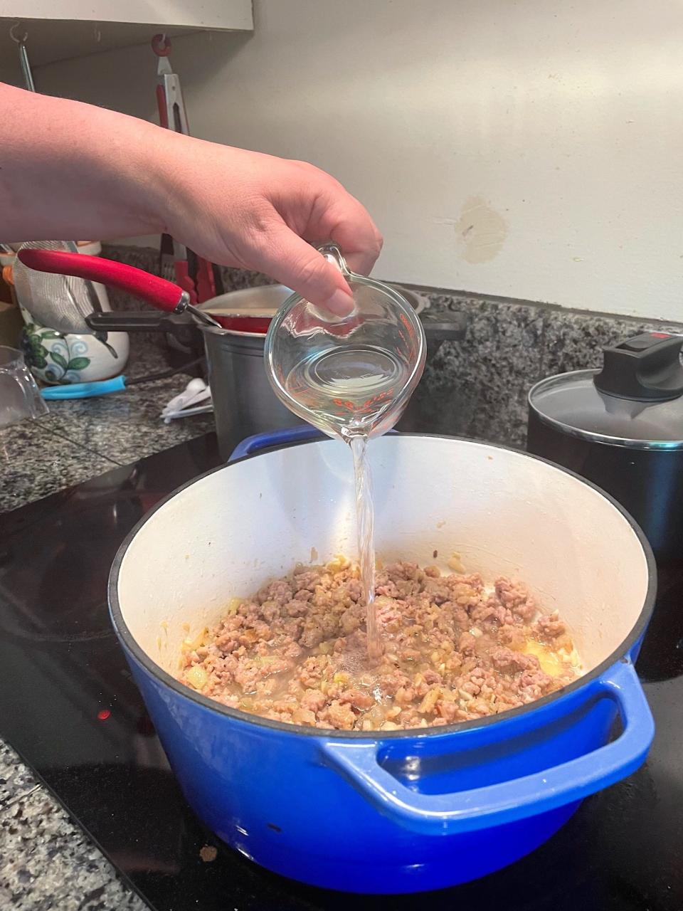 Adding wine for Ina Garten's Rigatoni