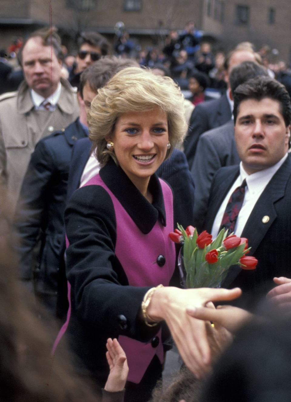 <p>The Princess wore a pink and black Catherine Walker suit, paired with pearl earrings, and her trademark blue eyeliner. </p>