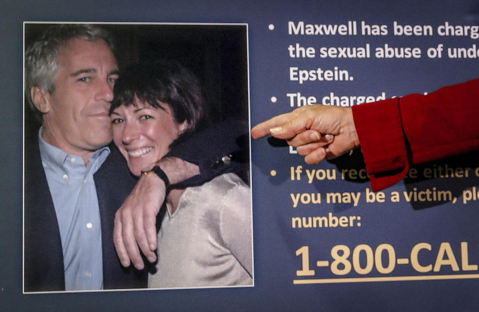 FILE — Audrey Strauss, acting U.S. attorney for the Southern District of New York, points to a photo of Jeffrey Epstein and Ghislaine Maxwell during a news conference in New York, July 2, 2020. When Jeffrey Epstein’s longtime companion Ghislaine Maxwell goes on trial next week, the accuser who captivated the public most, with claims she was trafficked to Britain’s Prince Andrew and other prominent men, won’t be part of the case. (AP Photo/John Minchillo, File)