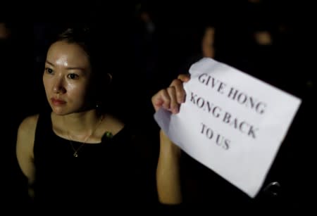 A woman is seen as she attends a rally in support of demonstrators protesting against proposed extradition bill with China, in Hong Kong