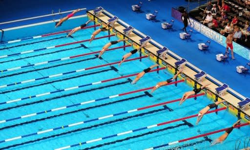 Competitors dive into the pool to start their race in Heat 5 of the Men's 100m Freestyle event on day four of the 2012 US Olympic Team Trials on June 28, in Omaha, Nebraska. The cut-throat US Olympic swimming trials winding up on Monday, just 26 days before the start of competition in London, were the perfect preparation for the Games, the top US coaches said