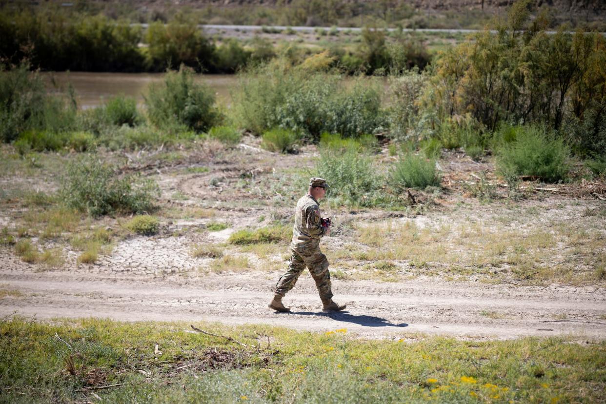 Texas National Guard place concertina wire near the banks of the Rio Grande that is directly in front of Sunland Park, New Mexico, Monday, October 9, 2023.